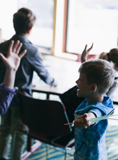 playful interaction between child and volunteer during kids church