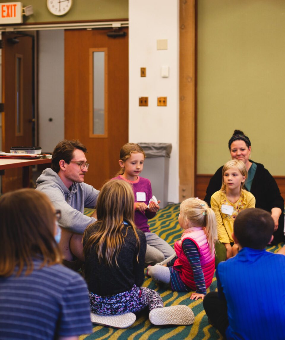 conversation between kids and volunteers during wednesday night kids church